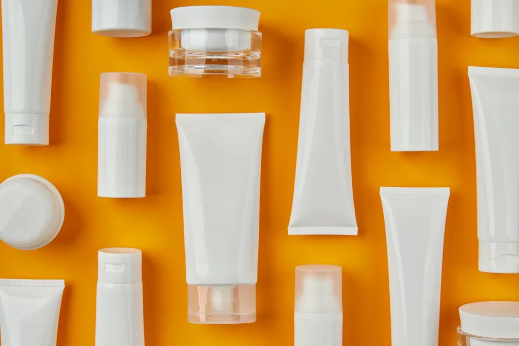 a lot of face moisturizers in a orange background