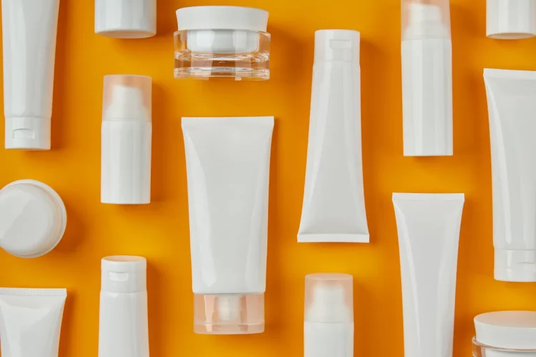 creams a lot of face moisturizers in a orange background
