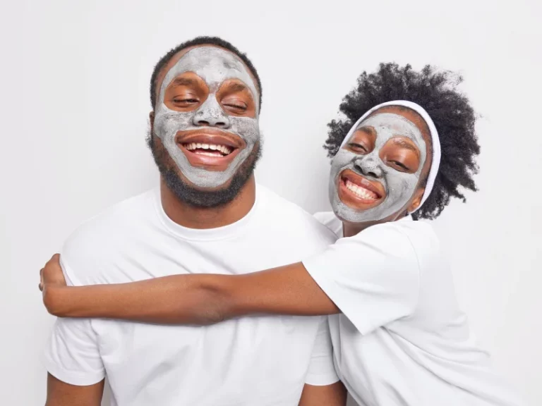 A black man and woman exfoliating the skin