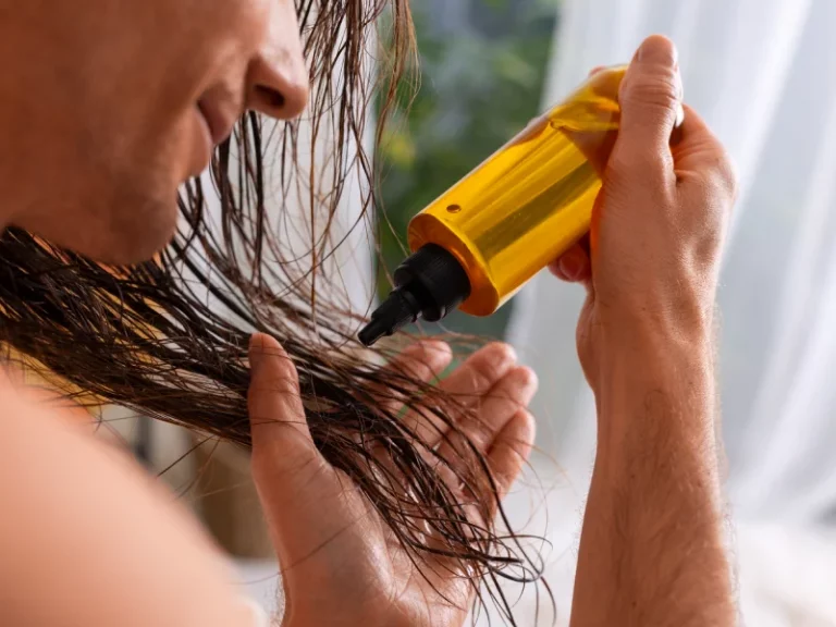 A man moisturizing his hair